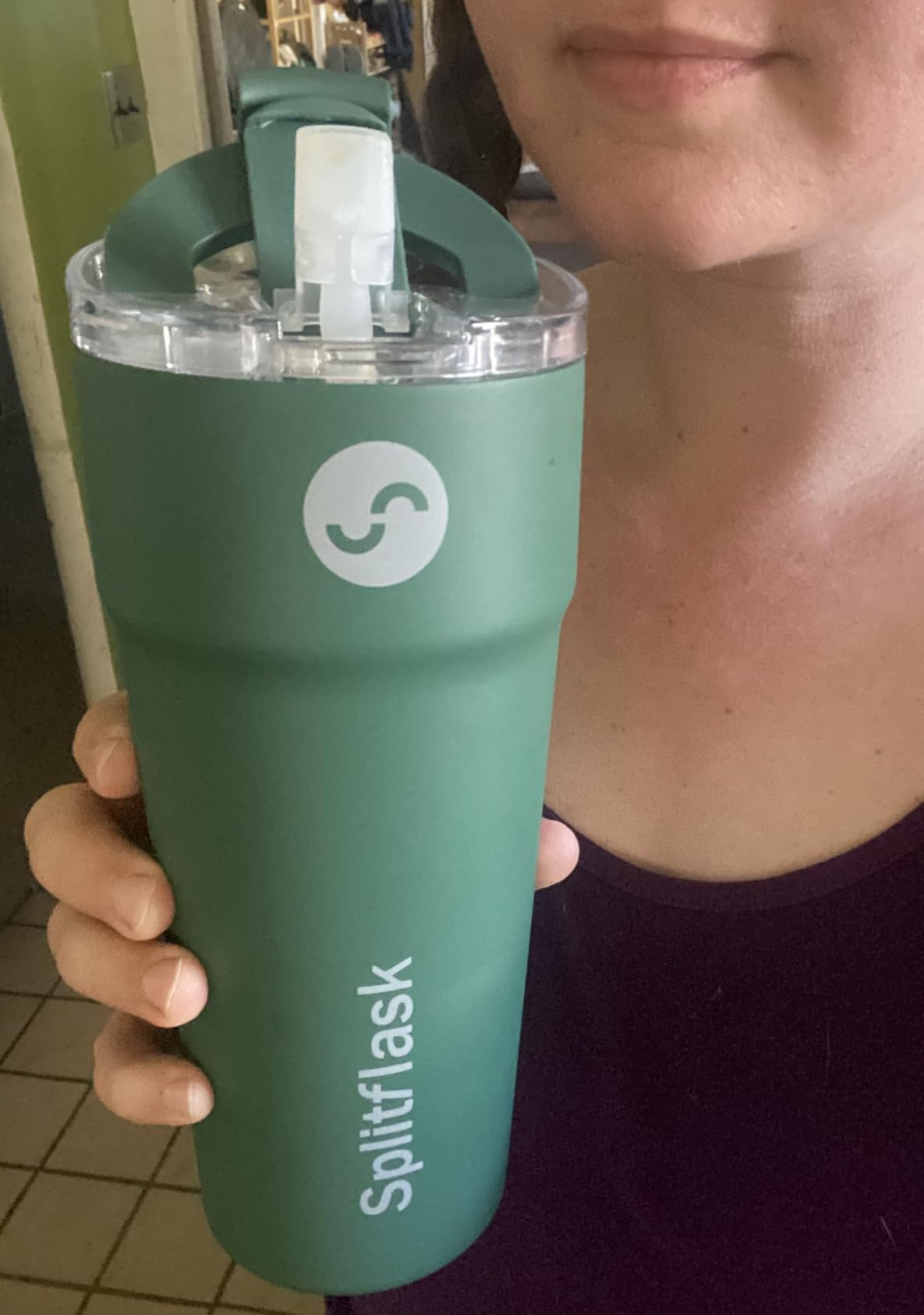 Customer holding a green Splitflask